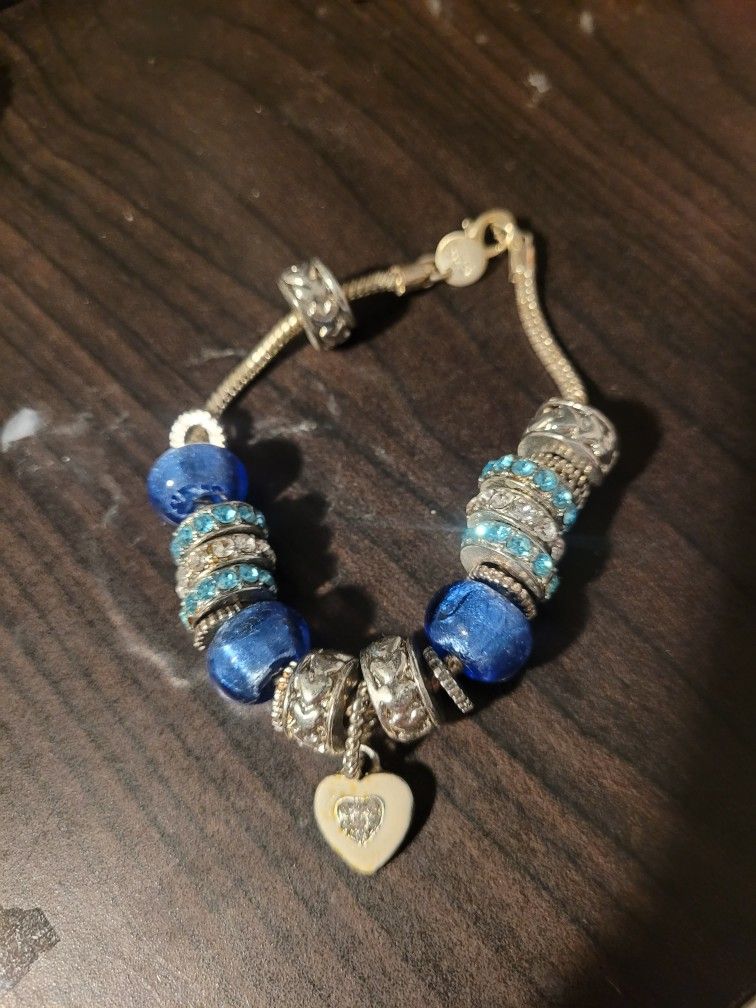 Blue, white, and silver pandora like bracelet for medium/large wrists