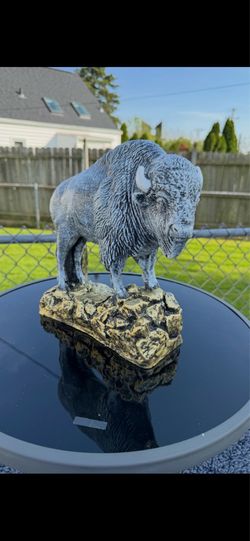 The old gray buffalo statue