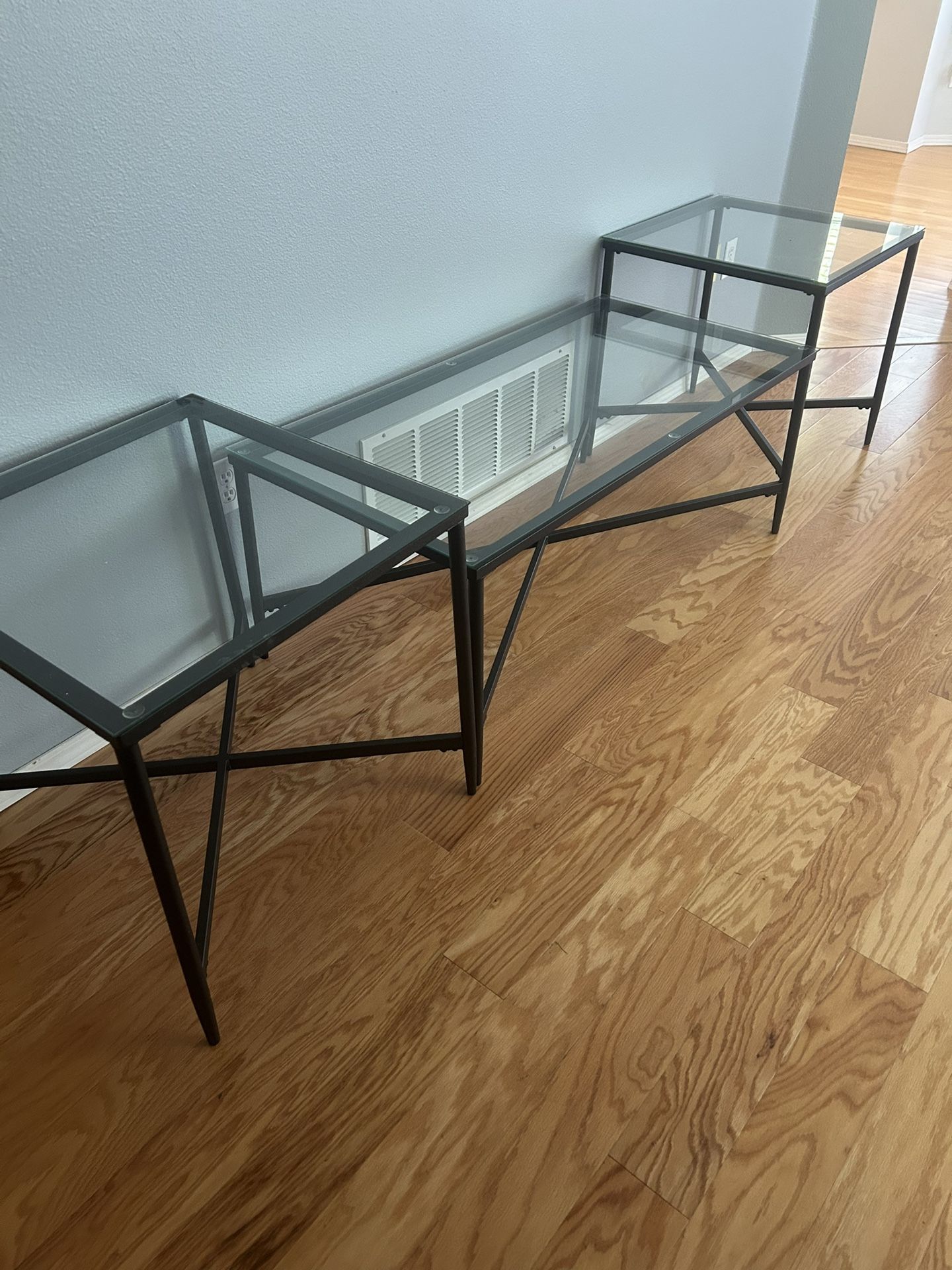 Set Of Three Black And Glass Tables, $100