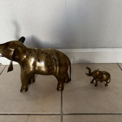 Two Vintage Brass Elephant .  the measurements of the By large one are. 12” Long and 13” High. 