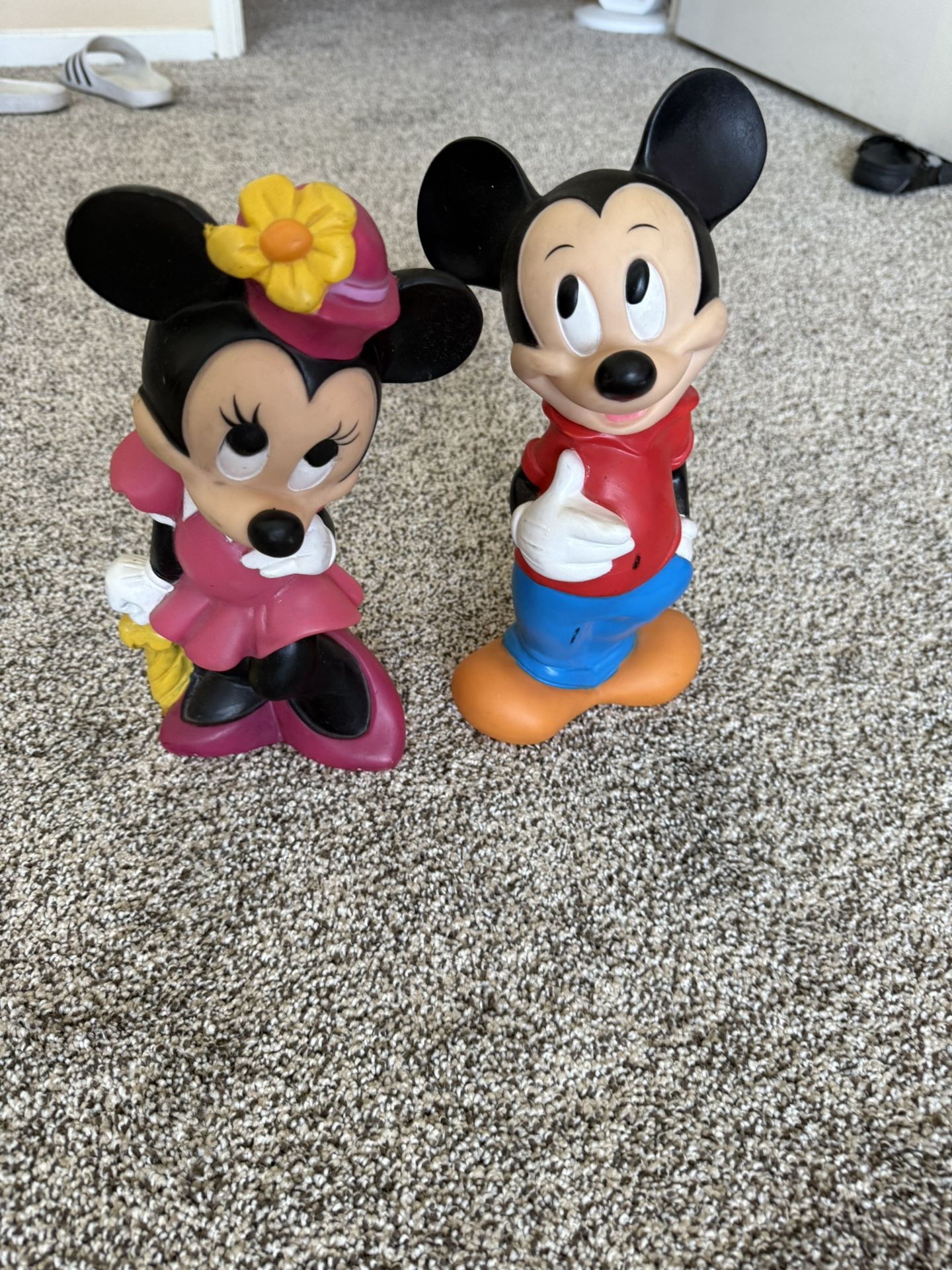 The product is a vintage 11" tall Mickey And Minnie Mouse vinyl bank from Walt Disney Productions, made in the 1970’s