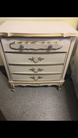 White bed side dresser with gold trim