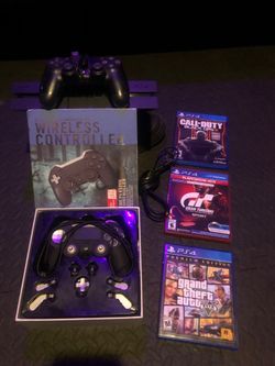 PS4 W/2 CONTROLLERS AND GAMES
