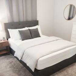 Home Goods full-size gray bed with 4 pull-out drawers.