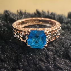 14K Rose Gold over 925 Sterling Silver with a Aquamarine stone.