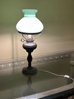 vintage electric table lamp featuring a brass or bronze metal base Collectable