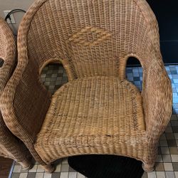 A Set Of Wicker Chair And A Little Couch
