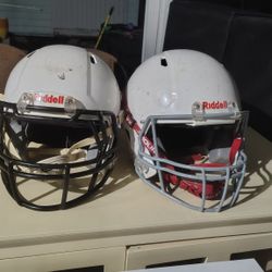 2 Football Helmets And 2 Pair Of Football Cleats 
