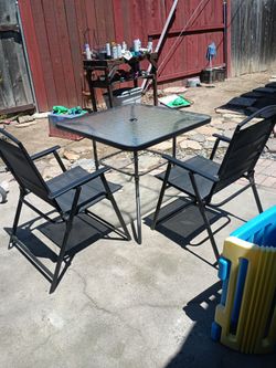 Table n 4 chairs like new u can put a umbrella in the center nice need gone moving