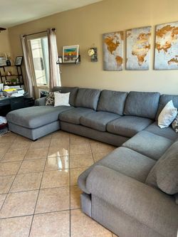 Beautiful large grey sectional couch from Jerome’s
