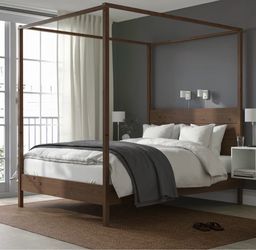 IKEA wood canopy bed frame