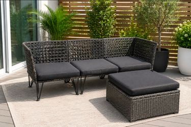 Original IKEA outdoor patio furniture set — modern wicker/rattan style with cushions.