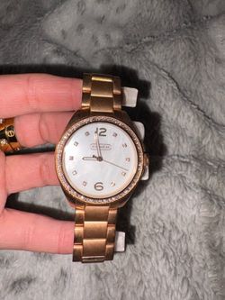 Coach rose gold/ pearl face watch $50