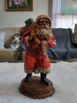 Dark skin ceramic Santa with bag af toys