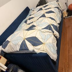 Blue upholstered sofa bed