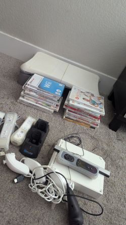 Wii console with games, four remotes, four joysticks