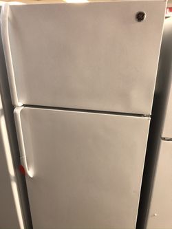 Used GE top and bottom fridge. 1 year warranty