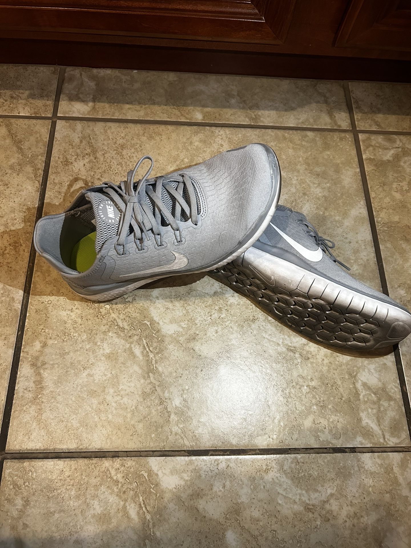 Grey Nike Free runs. 