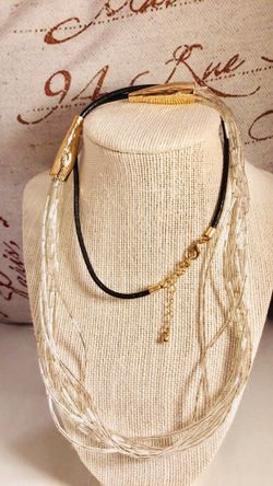 Stylish very long necklace with beautiful long glass bead tubes with thick leather cord attached to gold tone chain