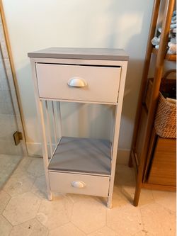 Small storage unit- great for bathroom, play room or office.
