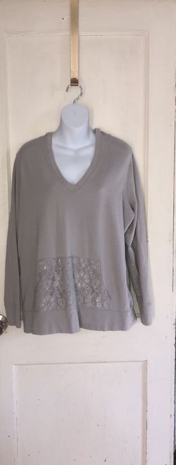 Women’s Torrid size 0 grey hoodie with lace on the front pocket and inside the hood