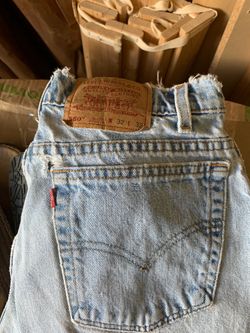 Old worn Levi’s stonewashed Jeans with holes
