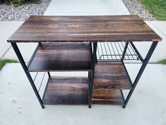 baker's rack
metal frame, wood top
35.5x16x33H"