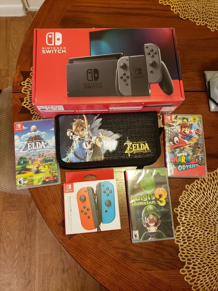 Nintendo Switch with games and extra controllers