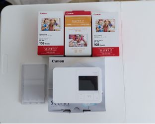 Canon Selphy CP1500 photo printer + 12 boxes of paper/ink