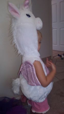 Two unicorn costumes