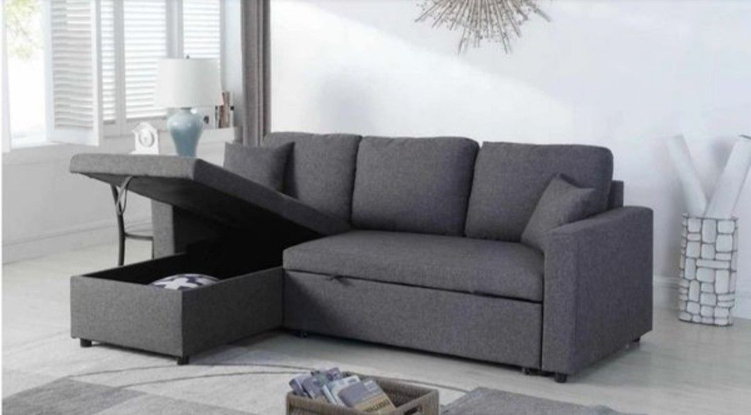 Grey sectional sofa pull out bed & storage chaise