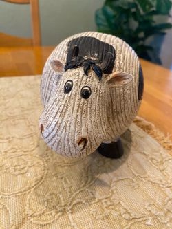 Cow statue made of resin with grooved stone look. 5 inch tall. Farmhouse/ cottage/ country.