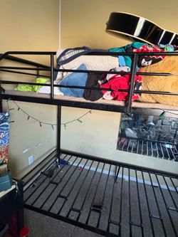 Black metal twin bunk beds