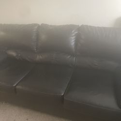 Black leather couches, loveseat, and sofa