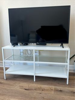 White and glass tv stand