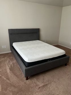 Queen Bed for Sale Queen-size bed with a fabric upholstered frame. Color: dark gray/blue. Clean and in good condition.