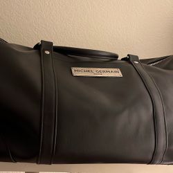 Michel Germain leather  weekend bag in Black