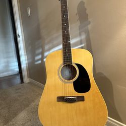 Acoustic guitar by Rogue - Natual finish