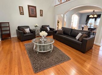 Dark Brown Leather sofa with ottoman