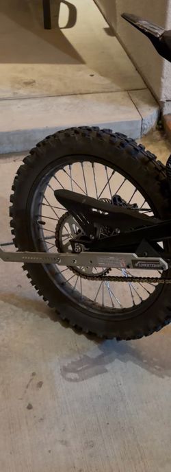 Surron wheelie trainer