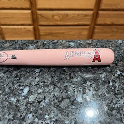 MLB Los Angeles Angels 18 inches Pink  Mini Wooden Baseball Bat.  Brand Louisville.  Preowned.  Has been on display in a cabinet with an Angels Baseba