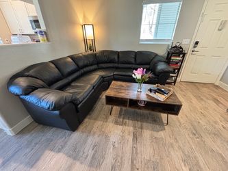 Black leather sectional sofa