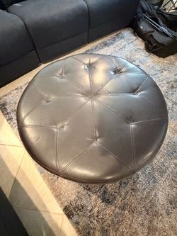 Round Tufted Faux Leather Ottoman