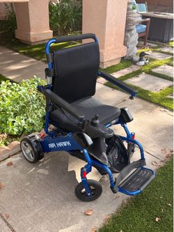Electric wheelchair with extra battery