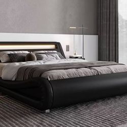 Bed base with King size led platform with adjustable headboard, no need for box spring, easy assembly, synthetic leather in black. $180