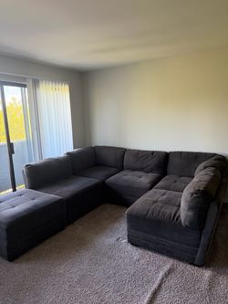 COSTCO Gray sectional couch and ottoman
