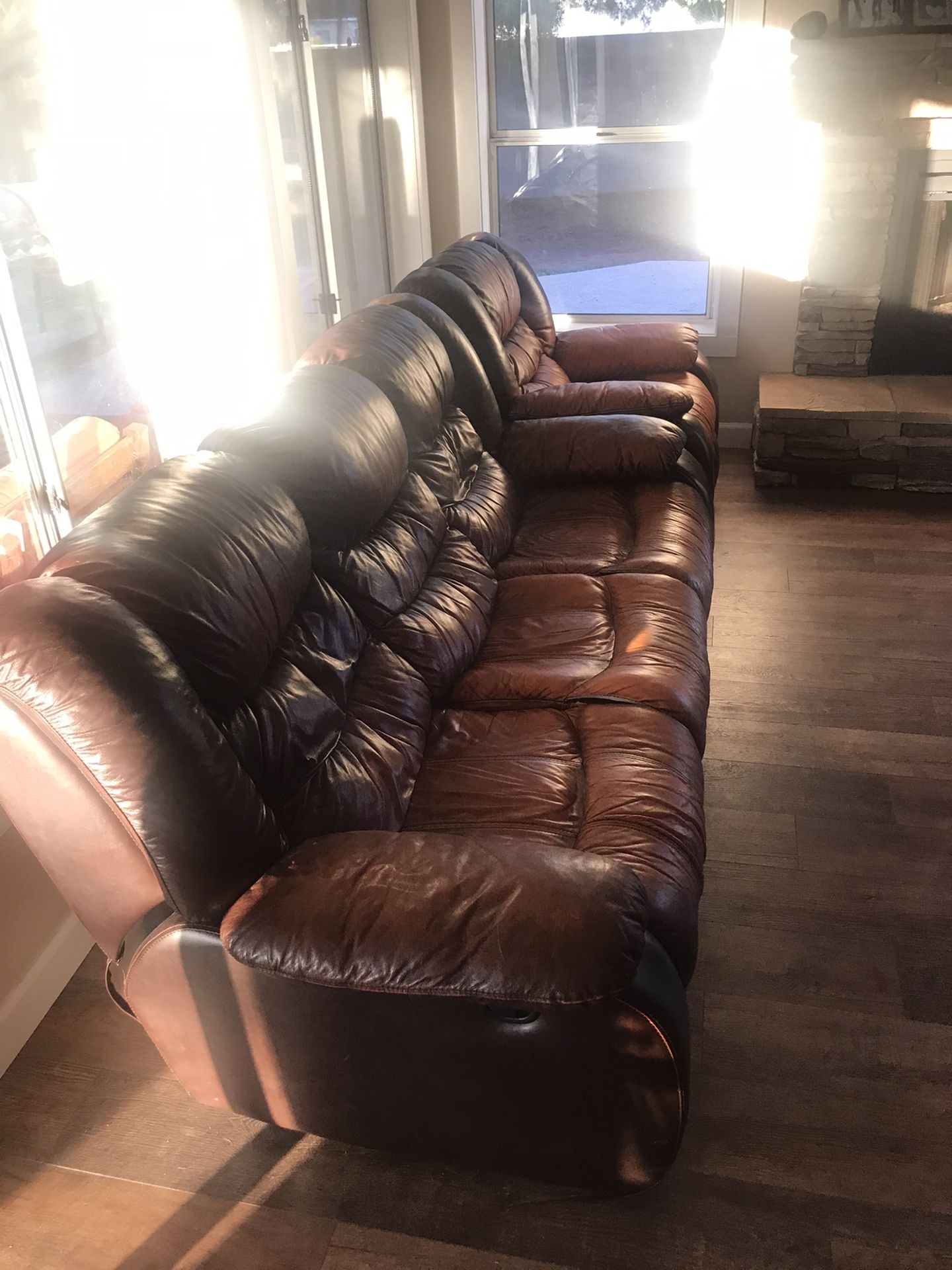 Brown leather recliner couch and one reclining rocker from Ashley Furniture for Sale in Gilbert