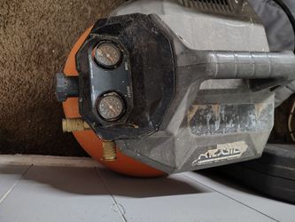 Ridgid 6 Gal. 150 PSI Pancake Air Compressor with dual pressure gauges and quick couplers