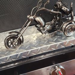 NUTS AND BOLTS METAL LADY MOTORCYCLIST SCULPTURE W/STAINLESS STEEL TREAD PATTERN SHELF