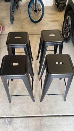 Black stainless steel barstools.
